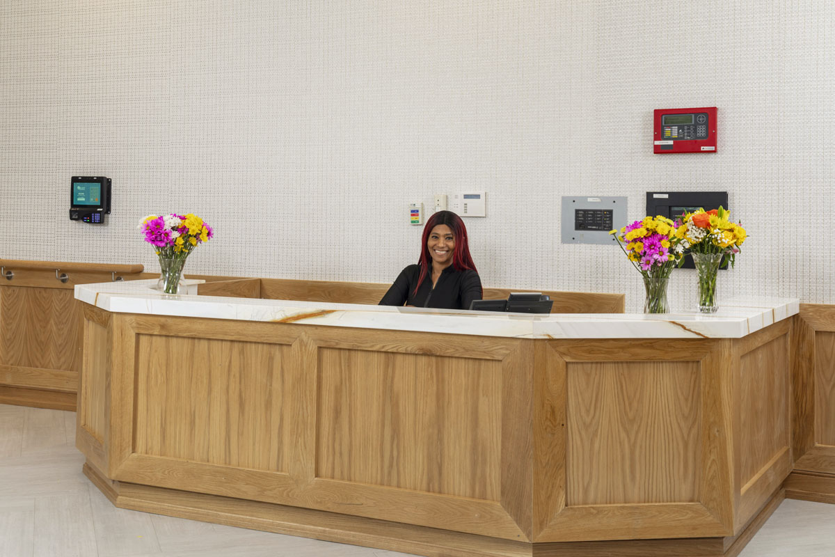 Greeting at front desk of Sutton Park in New Rochelle